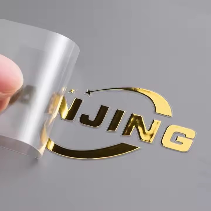 Custom raised metal emblem for electronic product packaging with 3D logo