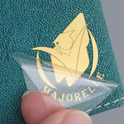 Custom raised metal emblem for electronic product packaging with 3D logo