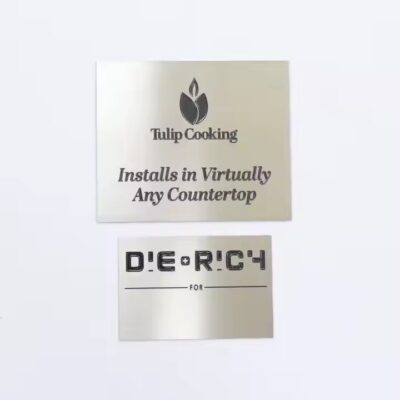 Custom printed metal nameplate with industrial logo and instruction details

