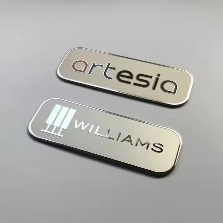 Custom printed metal nameplate with industrial logo and instruction details