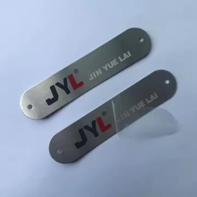 Custom printed metal nameplate with industrial logo and instruction details

