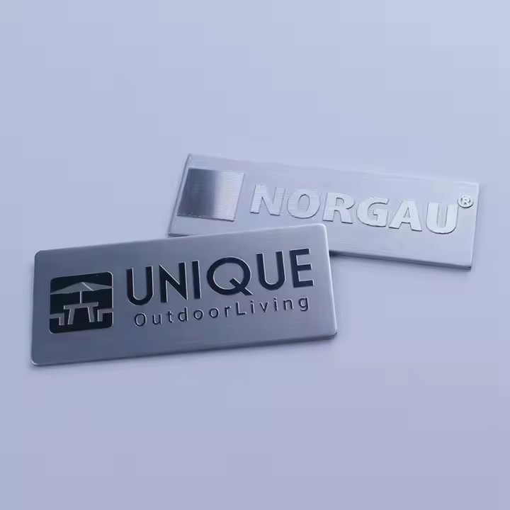 Brushed stainless steel tag with custom engraved brand logo