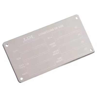 Embossed stainless steel branding label with raised logo design