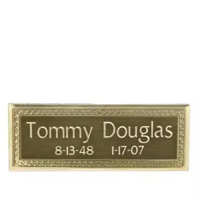 Custom brass brand logo label with detailed engraving

