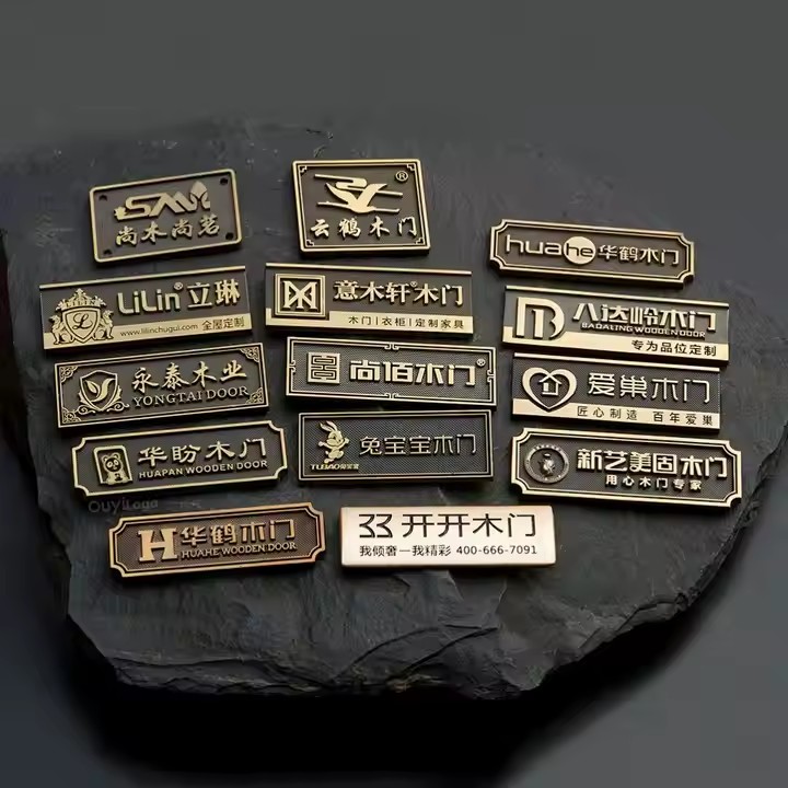 Custom brass label attached to furniture and handbag surface