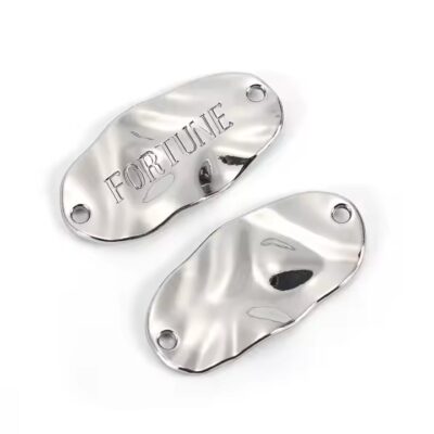 Custom engraved letter metal label with precise lettering
