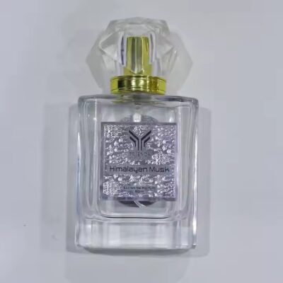 High-quality embossed metal label on perfume bottle