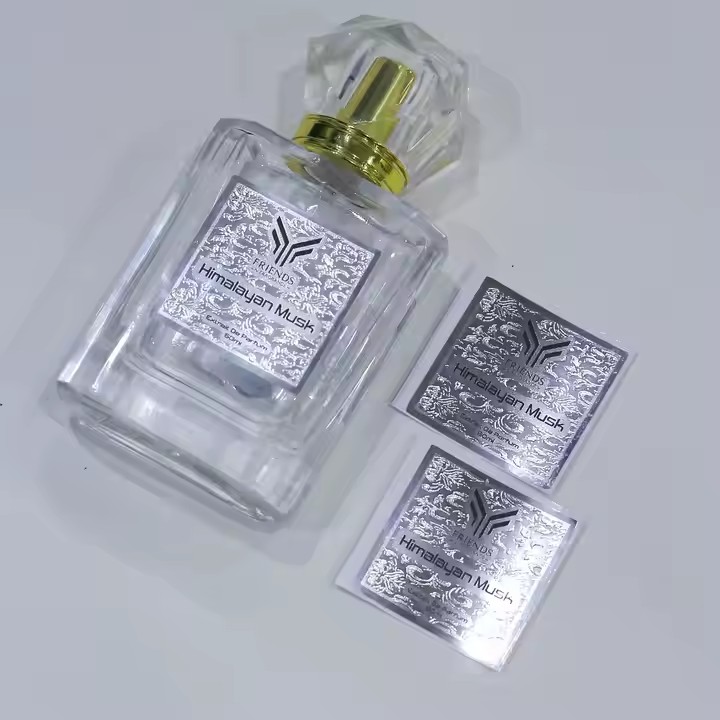 High-quality embossed metal label on perfume bottle