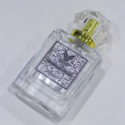High-quality embossed metal label on perfume bottle