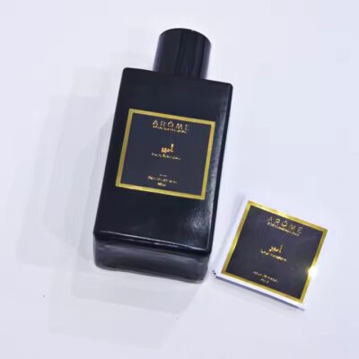 Custom metal adhesive label on a luxury perfume bottle