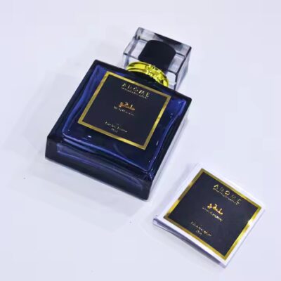 Custom metal adhesive label on a luxury perfume bottle