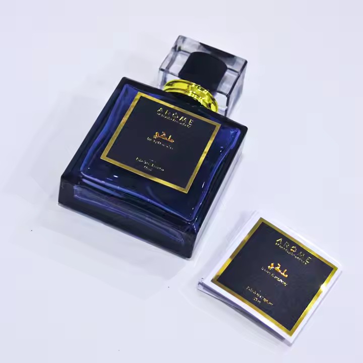 Custom metal adhesive label on a luxury perfume bottle
