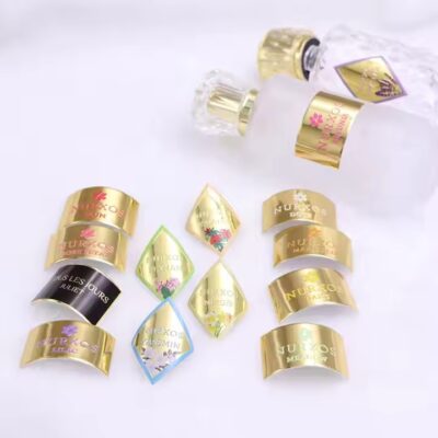 Custom embossed aluminum adhesive label with metallic finish