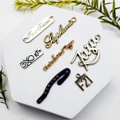 Custom metal tag with engraved logo for handbags and wallets