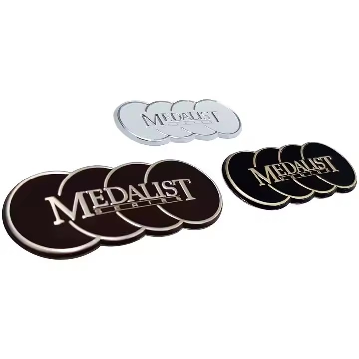 Decorative embossed metal label with intricate design on metal surface