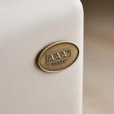 Custom engraved brass furniture decorative label attached to wood surface
