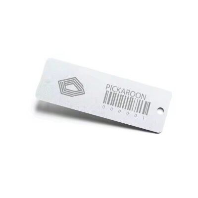 Weatherproof metal barcode label attached to a garden tree, ideal for plant tracking and identification
