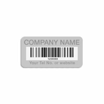 Weatherproof metal barcode label attached to a garden tree, ideal for plant tracking and identification