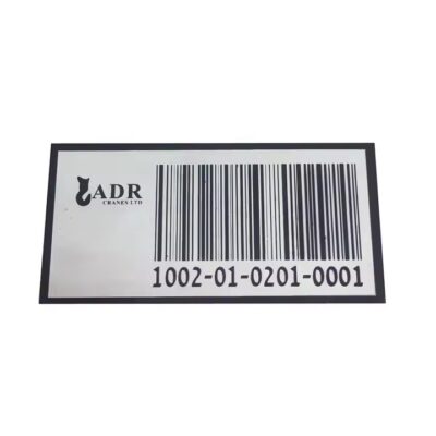 Weatherproof metal barcode label attached to a garden tree, ideal for plant tracking and identification