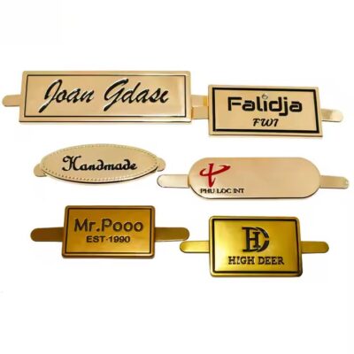 High-quality laser engraved metal tag attached to a luxury handbag