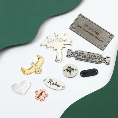 Custom laser engraved metal tag showcasing apparel brand logo on clothing

