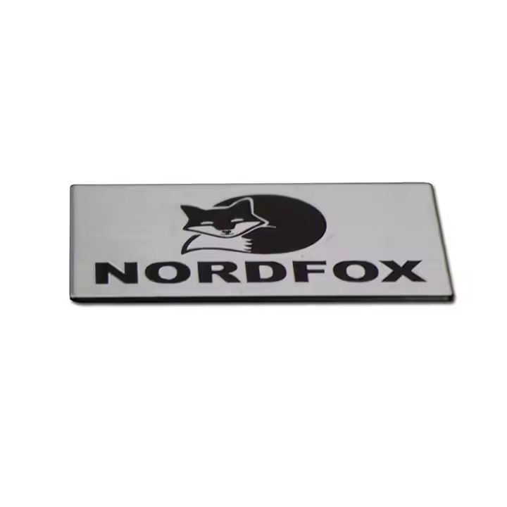 Laser etched stainless steel metal tag with custom logo and industrial marking