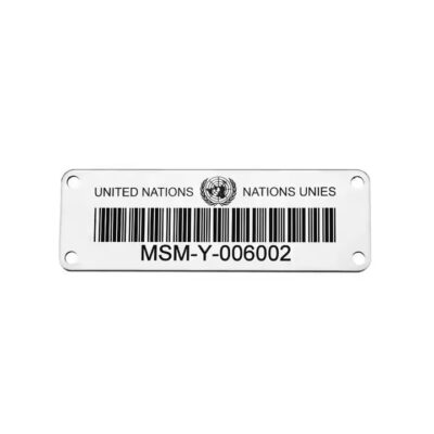 Weather-resistant metal plant barcode label attached to a garden plant or tree