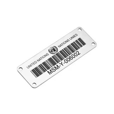 Weather-resistant metal plant barcode label attached to a garden plant or tree