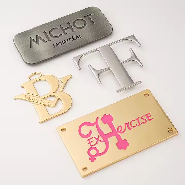 Custom metal tags with engraved letters for stylish handbag decoration
