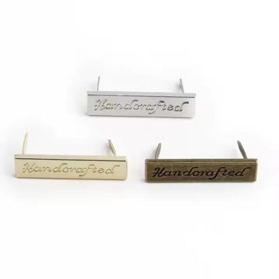 Custom laser engraved metal tag for handbags, clothing, and wallet branding
