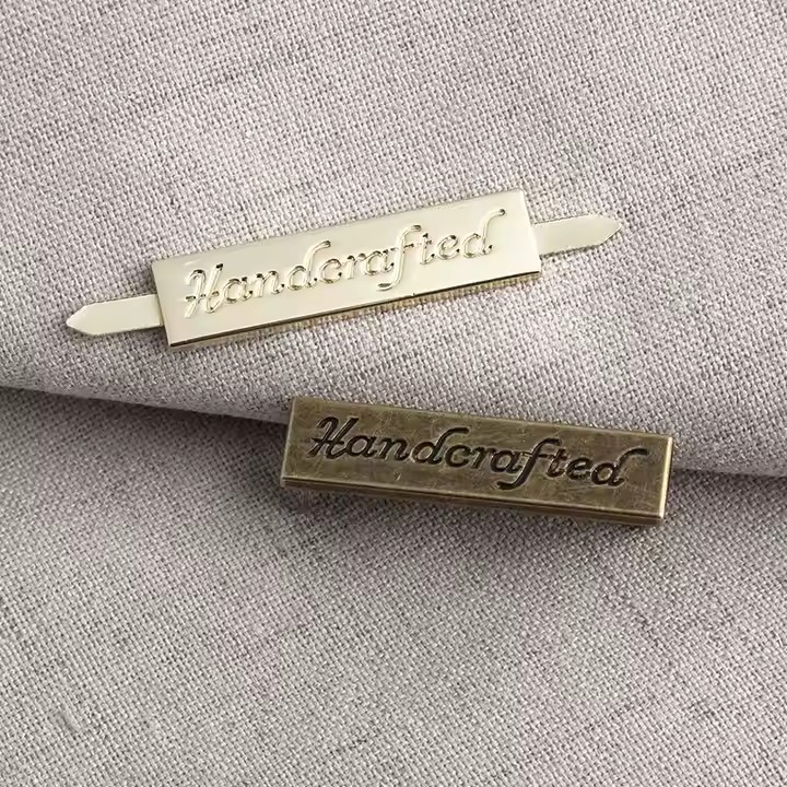 Custom laser engraved metal tag for handbags, clothing, and wallet branding