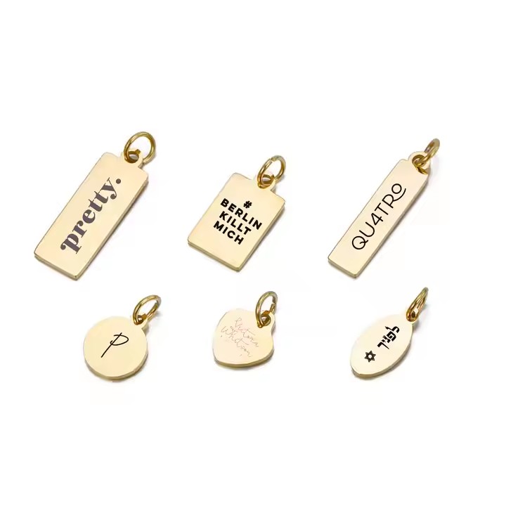 Custom laser engraved metal tag with pre-attached jump ring for product labeling