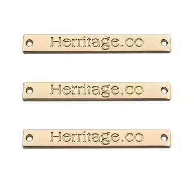 Durable washable laser engraved metal tag attached to clothing and bags